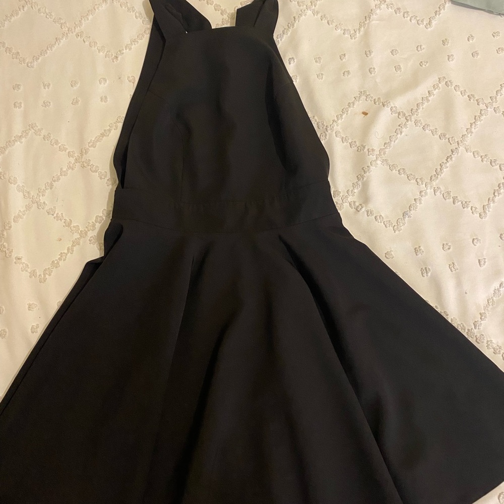 Black mini dress with bow detail and open back